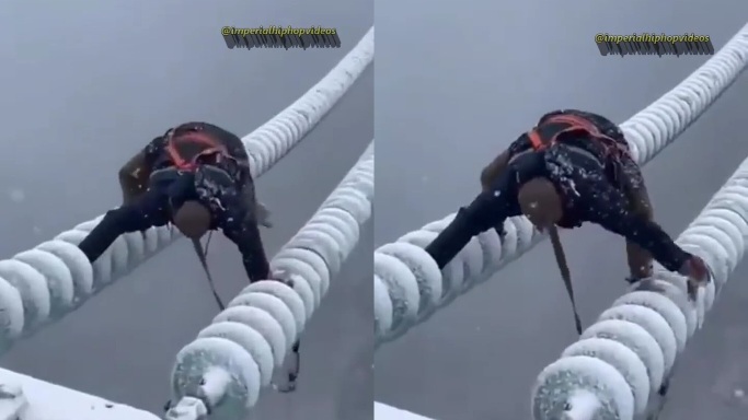 Would You Work for a Million Dollars to Help This Guy? Man Scales a Tall Structure in the Presence of Snow