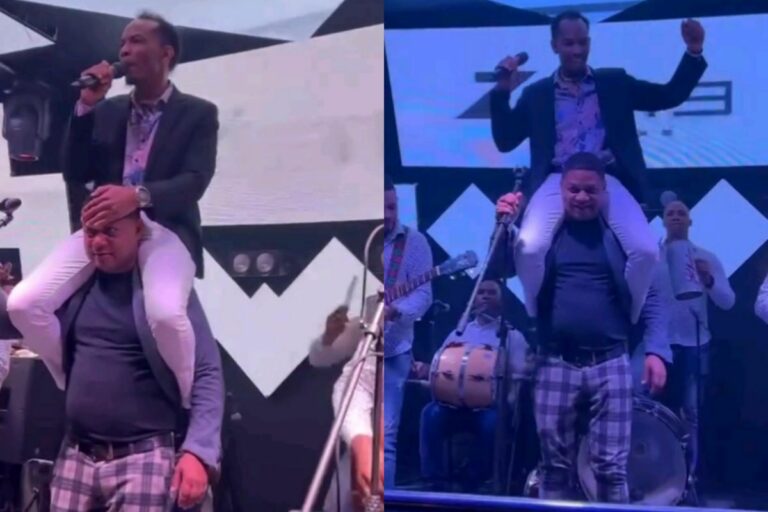 Dominican Papi Singer sits atop another Man’s head as he performs a hit song!  Take a look at Him!