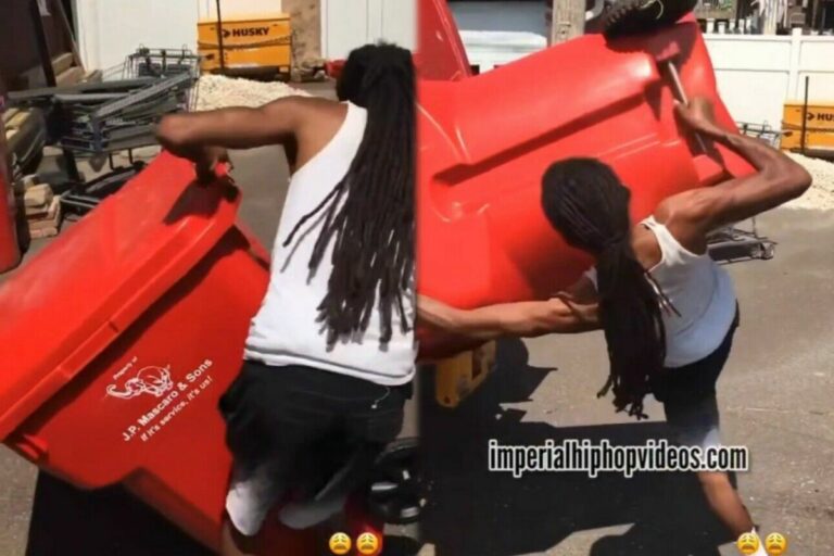 Unfortunate Mishap: Man With Slim Build and Dreadlocks Takes a Tumble While Attempting to Lift Trash Can